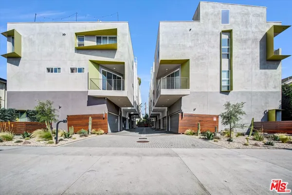 a view of multiple house with a street