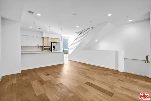 a view of kitchen with wooden floor