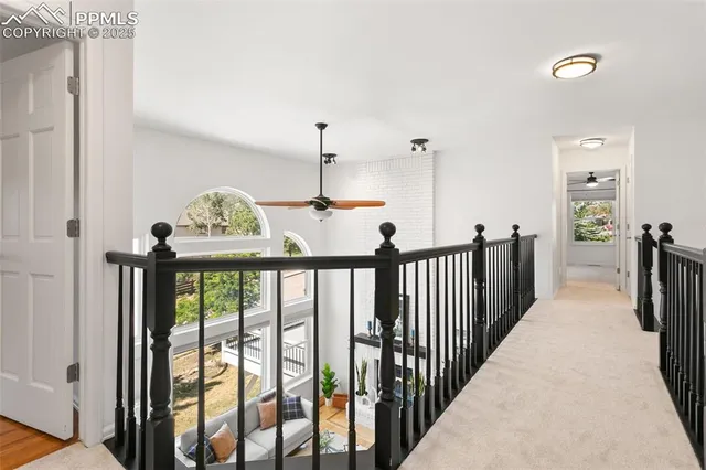 a view of a hallway with windows