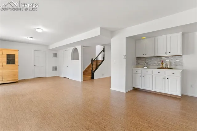 a view of kitchen with cabinets and wooden floor