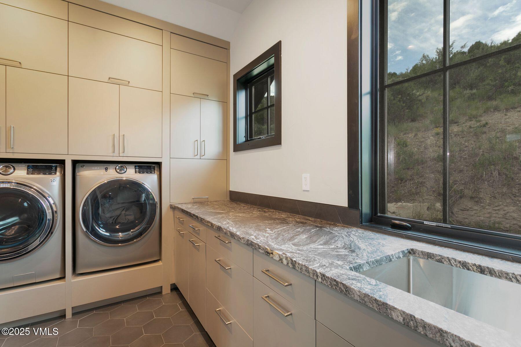420 Little Andorra Road Edwards, CO 81632 - Photo 22 of 26 a utility room with sink dryer and washer