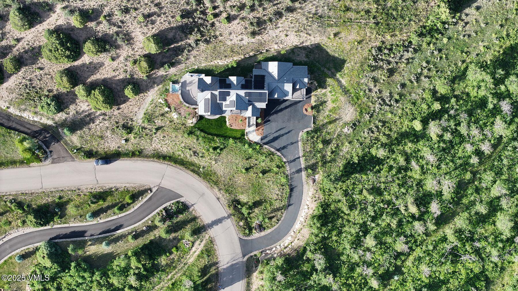 420 Little Andorra Road Edwards, CO 81632 - Photo 23 of 26 an aerial view of a house with a yard and large trees