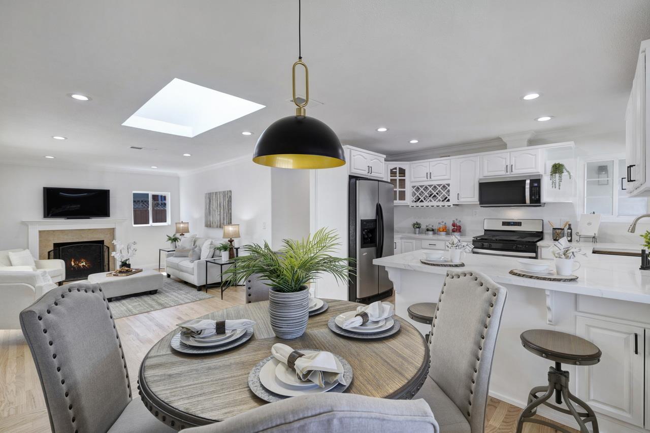 1075 Summerfield Drive San Jose, CA 95121 - Photo 14 of 38 a kitchen with sink refrigerator dining table and chairs