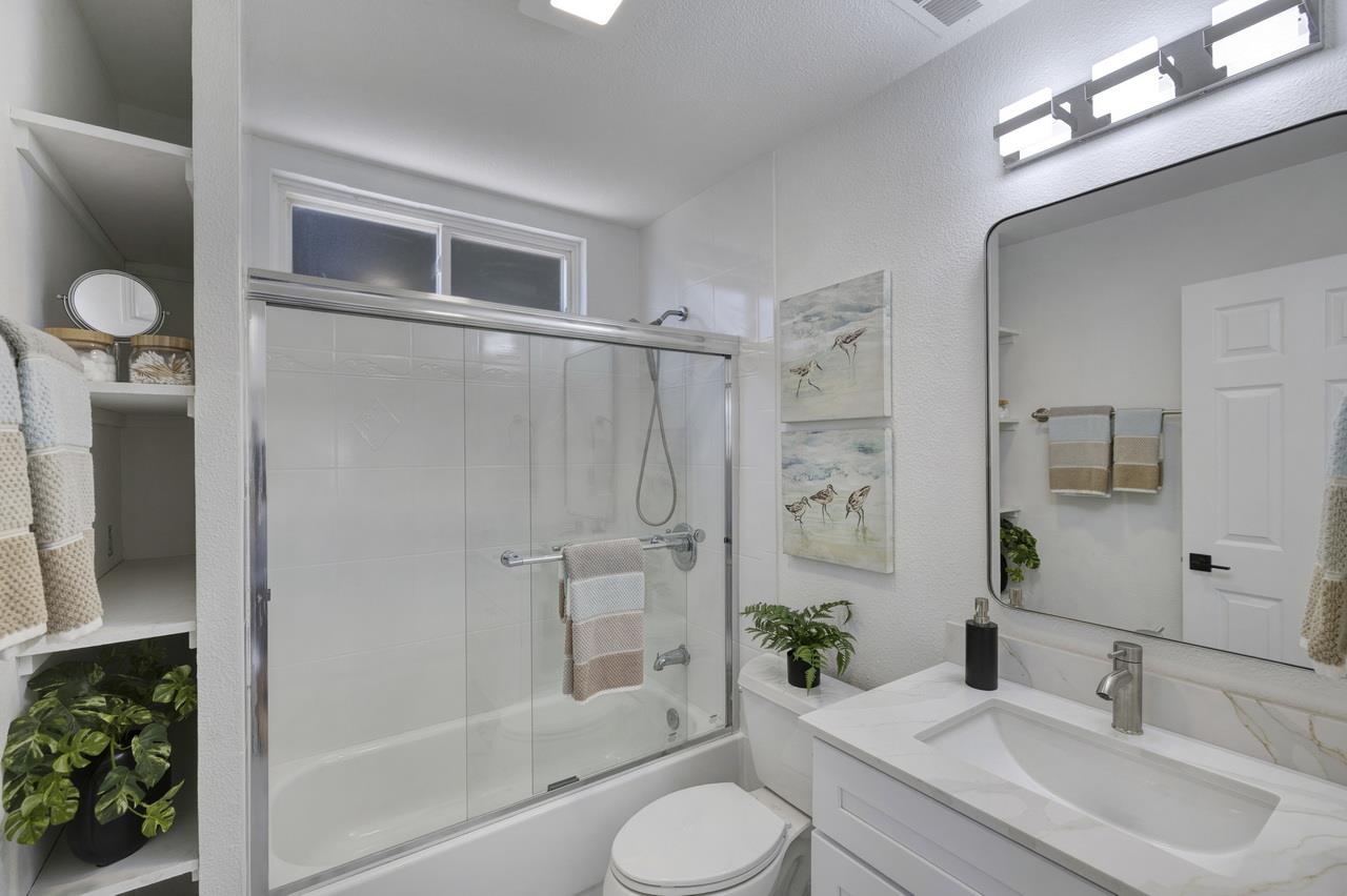 1075 Summerfield Drive San Jose, CA 95121 - Photo 23 of 38 a bathroom with a granite countertop sink toilet and shower