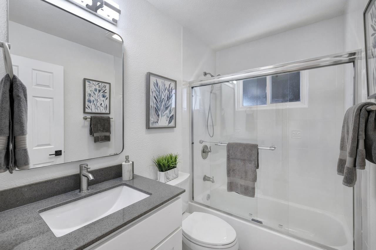 1075 Summerfield Drive San Jose, CA 95121 - Photo 30 of 38 a bathroom with a granite countertop sink toilet and shower