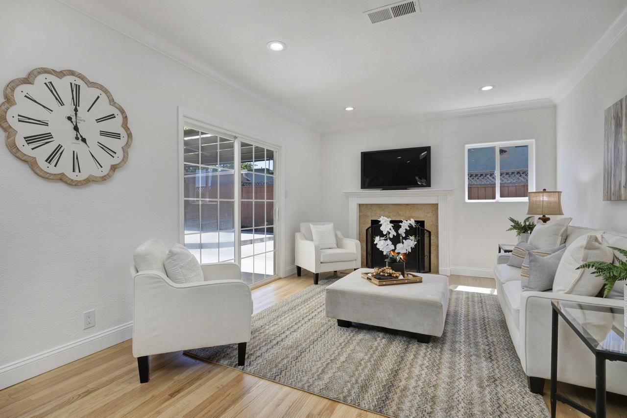 1075 Summerfield Drive San Jose, CA 95121 - Photo 8 of 38 a living room with furniture and a flat screen tv