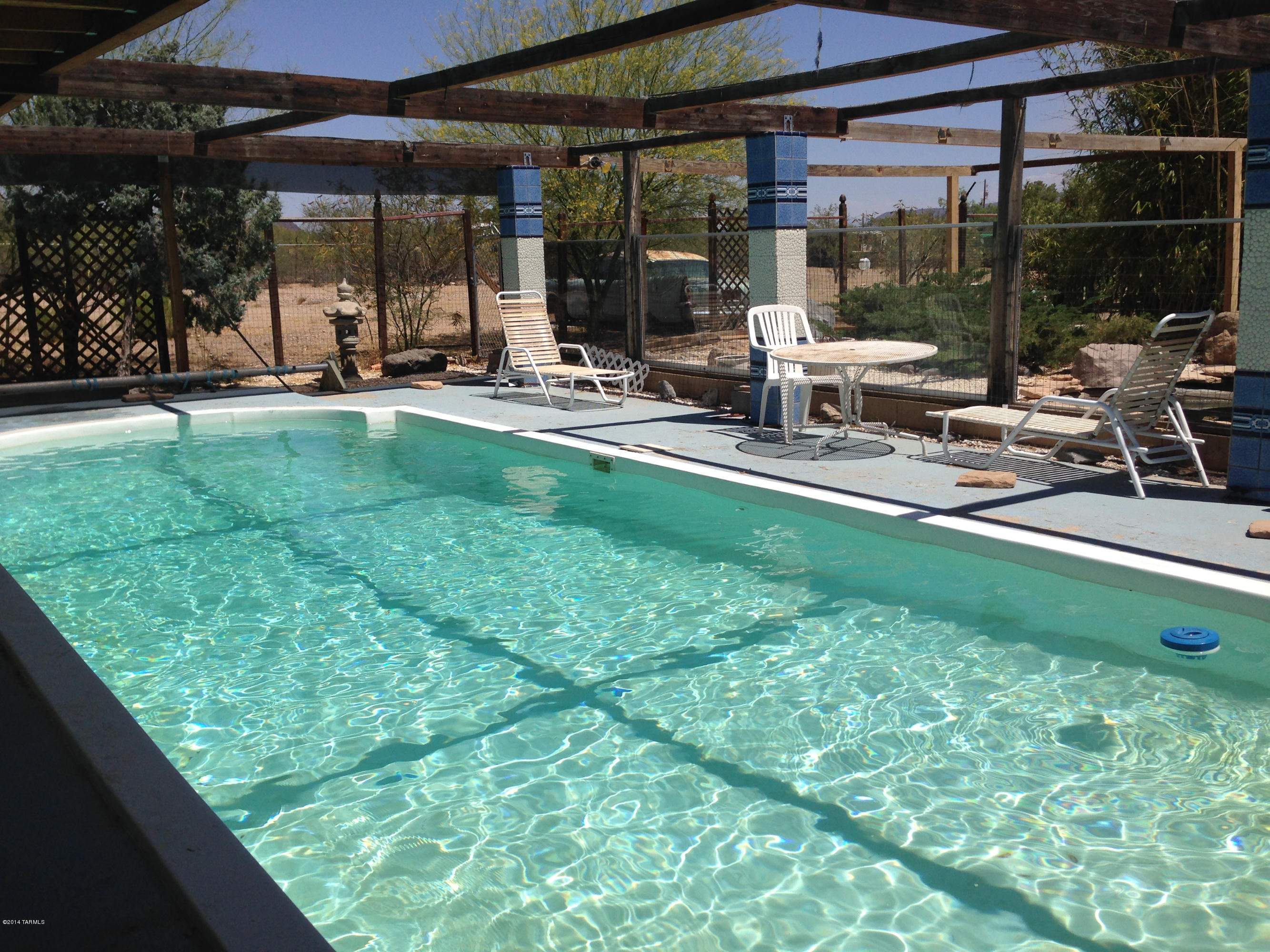 4515 South Aldon Road Tucson, AZ 85735 - Photo 2 of 32 a view of a backyard with sitting area and porch