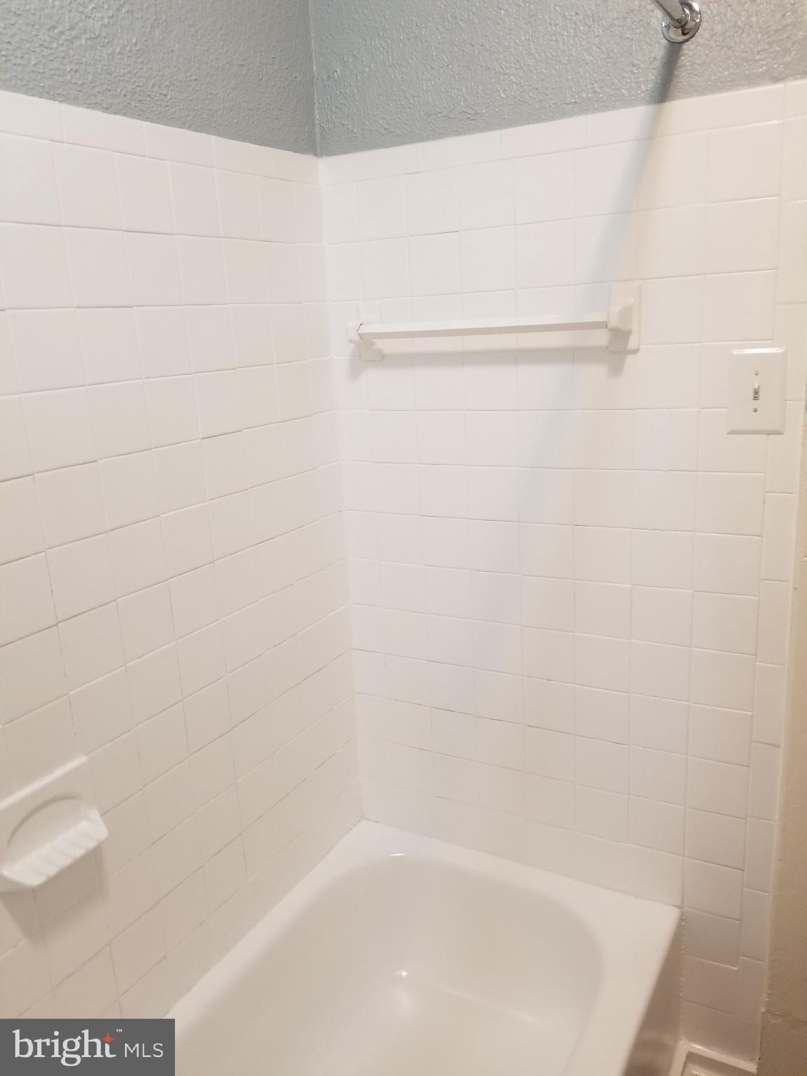 3109 Lawnview Avenue Baltimore, MD 21213 - Photo 12 of 23 a close up of a bathtub