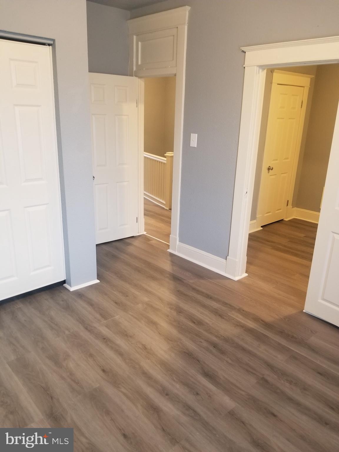 3109 Lawnview Avenue Baltimore, MD 21213 - Photo 14 of 23 an empty room with wooden floor and closet