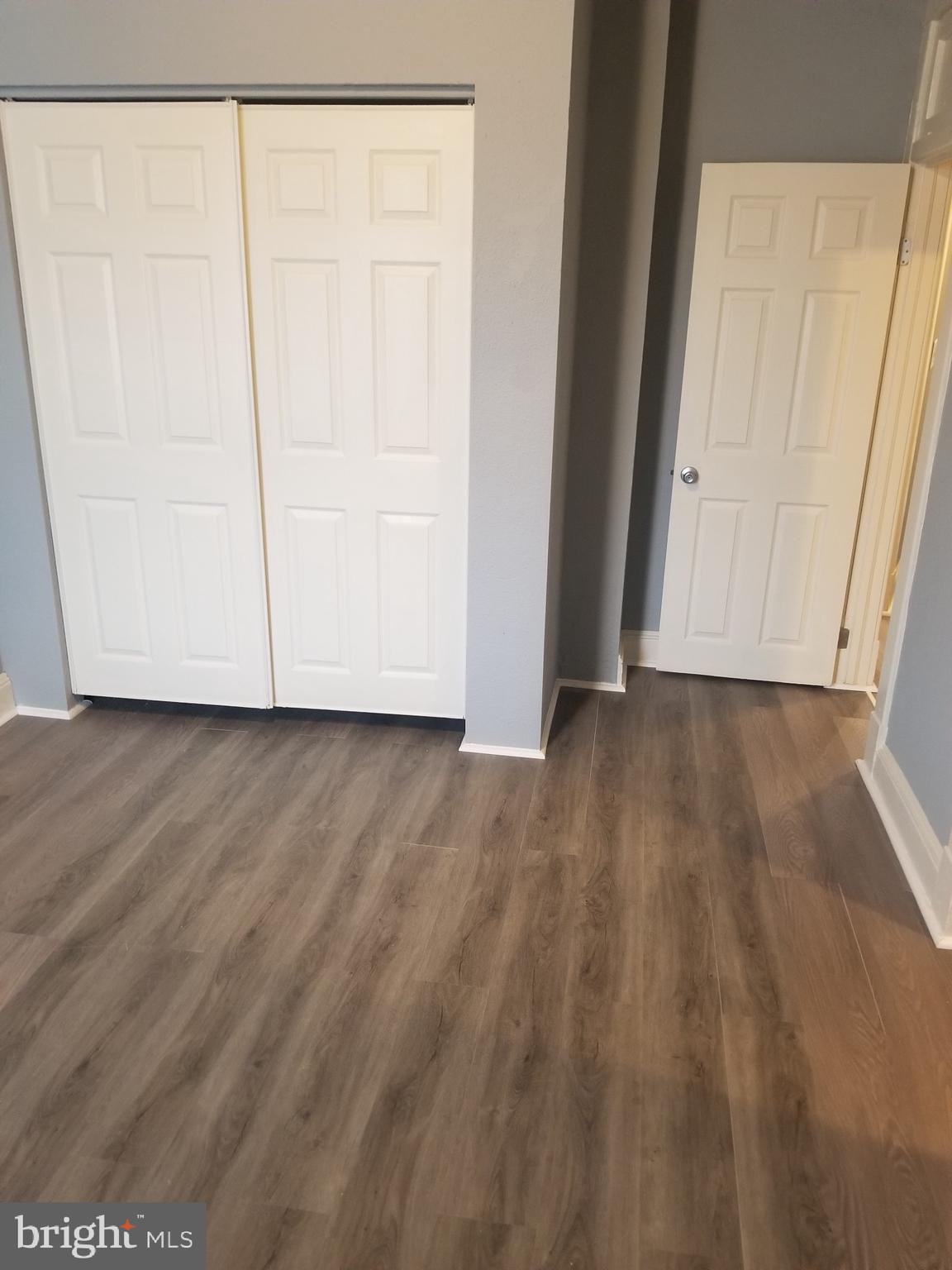 3109 Lawnview Avenue Baltimore, MD 21213 - Photo 15 of 23 a view of an empty room with wooden floor