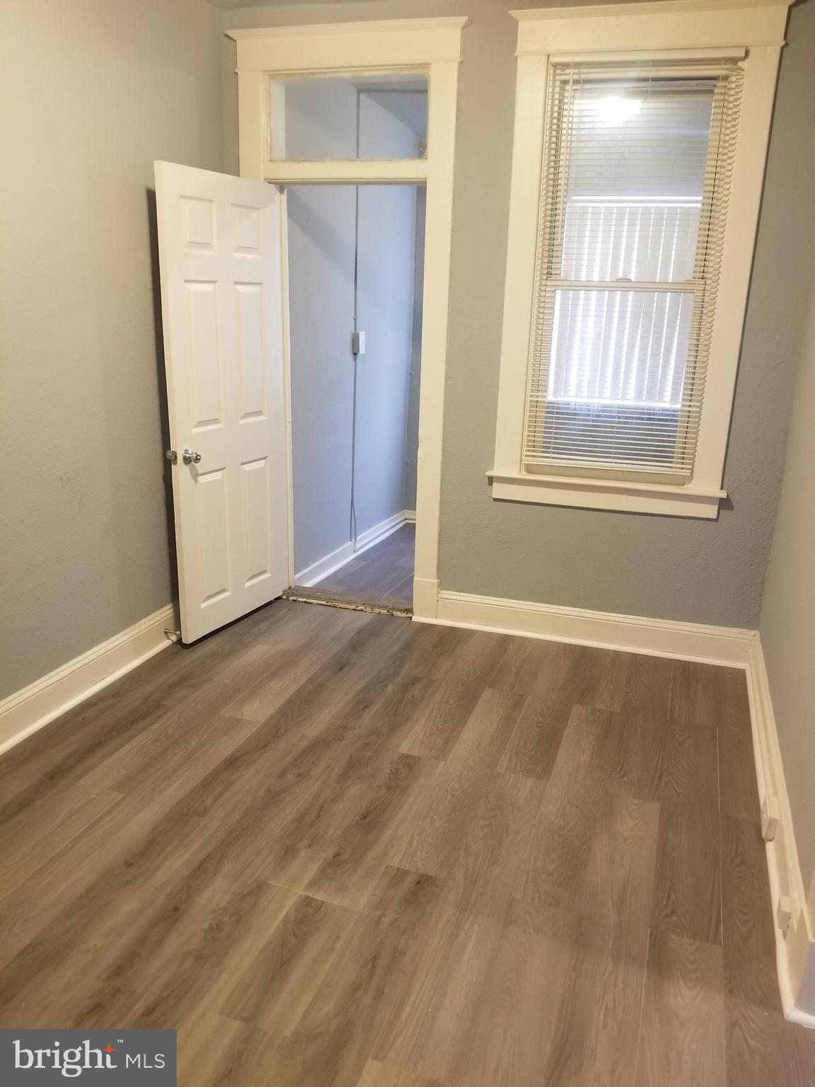 3109 Lawnview Avenue Baltimore, MD 21213 - Photo 16 of 23 an empty room with windows and cabinet