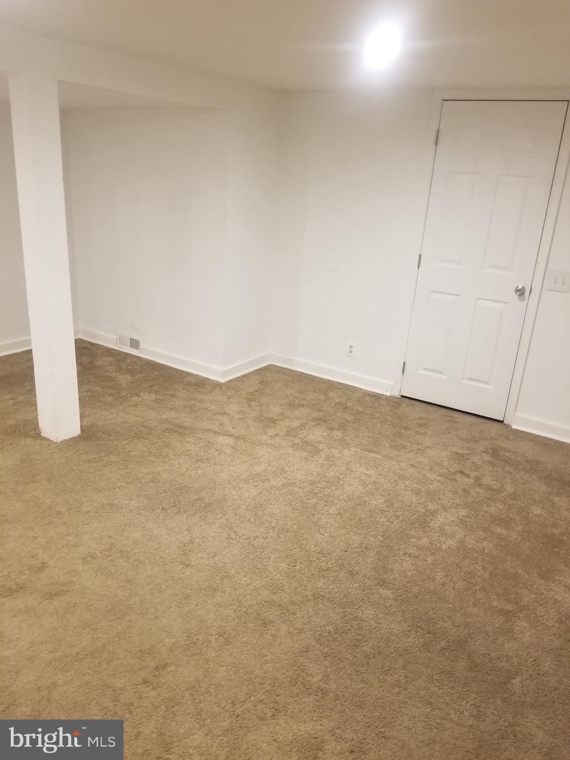 3109 Lawnview Avenue Baltimore, MD 21213 - Photo 23 of 23 a view of a refrigerator in an empty room