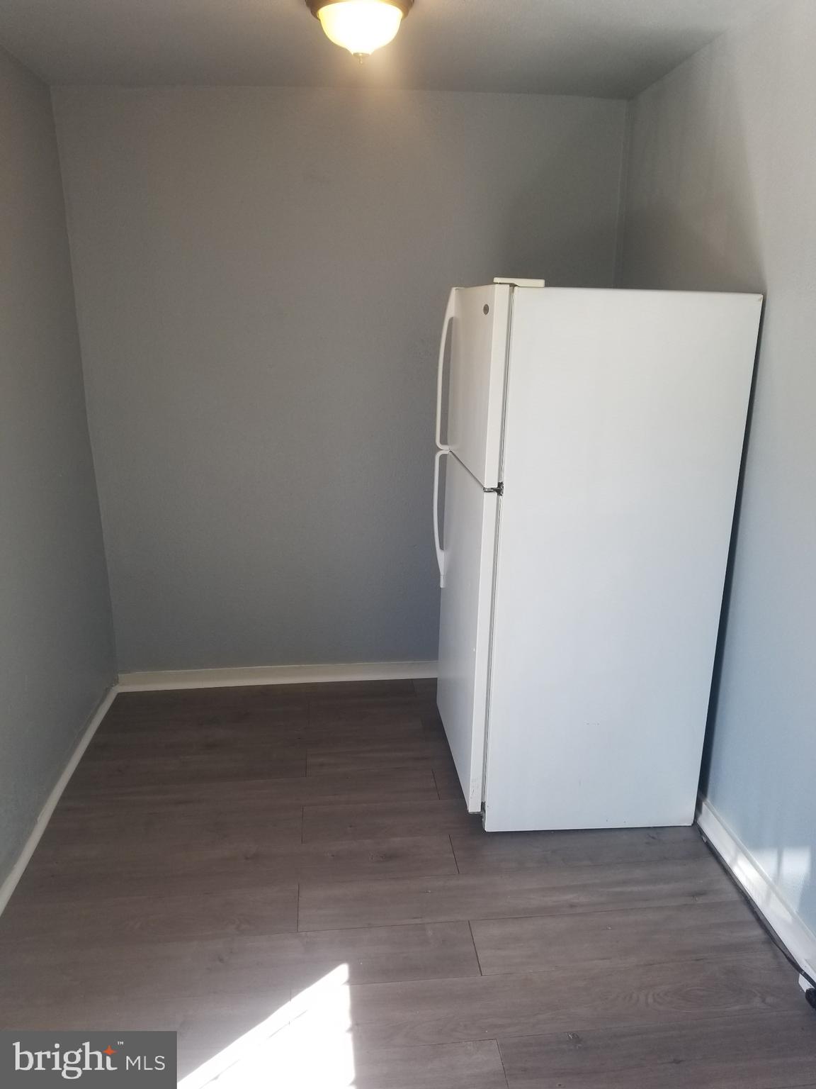 3109 Lawnview Avenue Baltimore, MD 21213 - Photo 7 of 23 a utility room with wooden floor washer and dryer