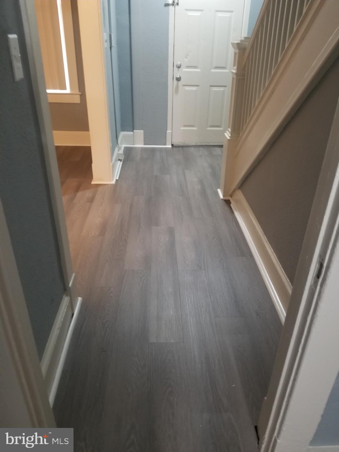 3109 Lawnview Avenue Baltimore, MD 21213 - Photo 10 of 23 a view of outdoor space and an empty room with wooden floor