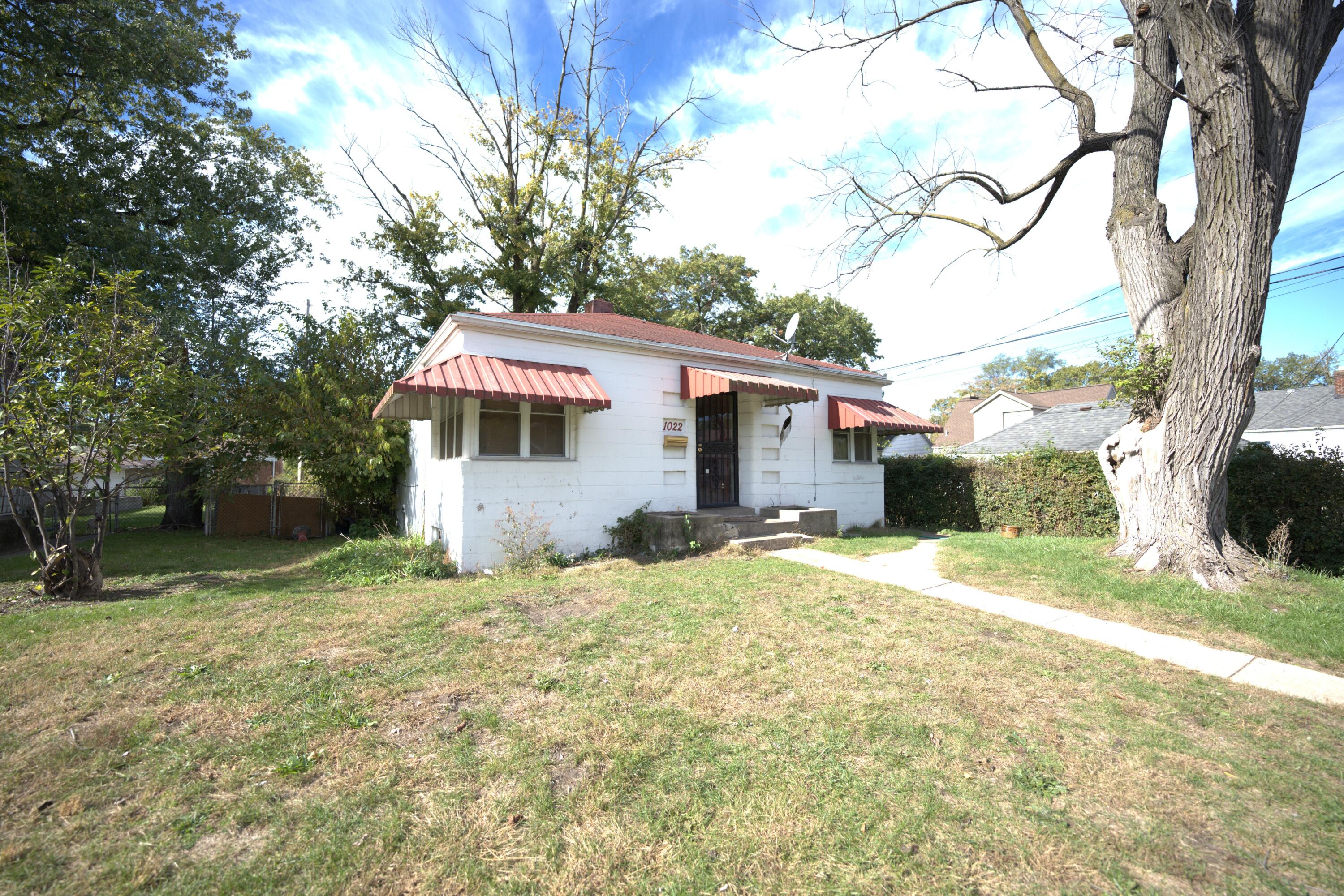 1022 Wright Street Gary, IN 46404 - Photo 2 of 2 a backyard of a house with yard and tree