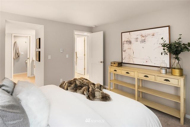 a bedroom with a bed and a dresser