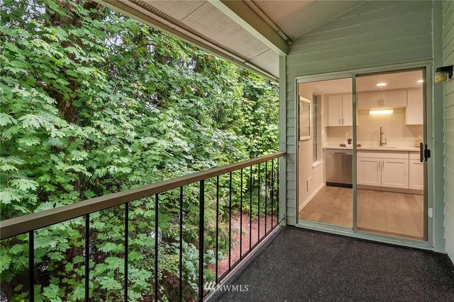 a view of a balcony with wooden floor