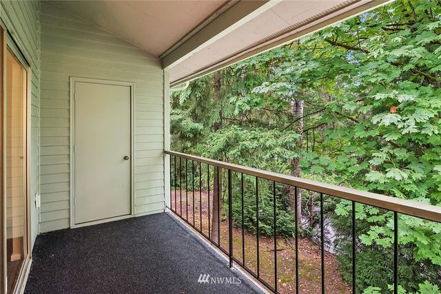 a view of a balcony with wooden floor