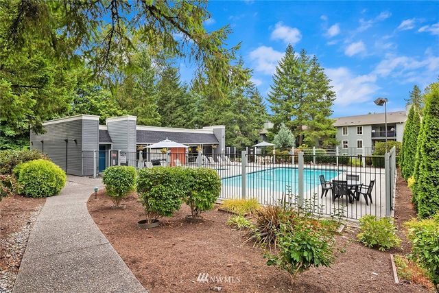 a view of a house with a chairs in a patio