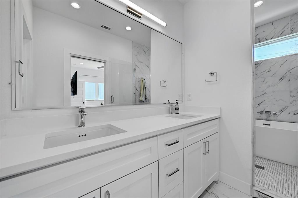2812 East 4th Street, Unit 2 Austin, TX 78702 - Photo 19 of 26 2nd floor bathroom - Double vanity with white cabinetry