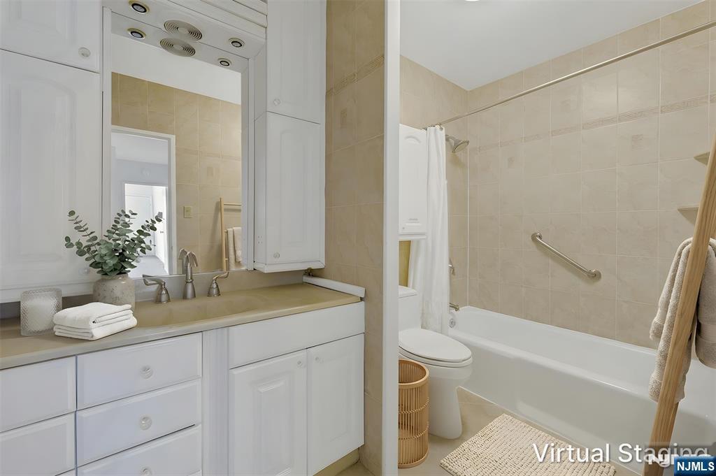 6 Horizon Road, Unit 1508 Fort Lee, NJ 07024 - Photo 10 of 46 a bathroom with a granite countertop sink a toilet and shower