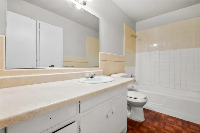 a bathroom with a sink a toilet and a bathtub