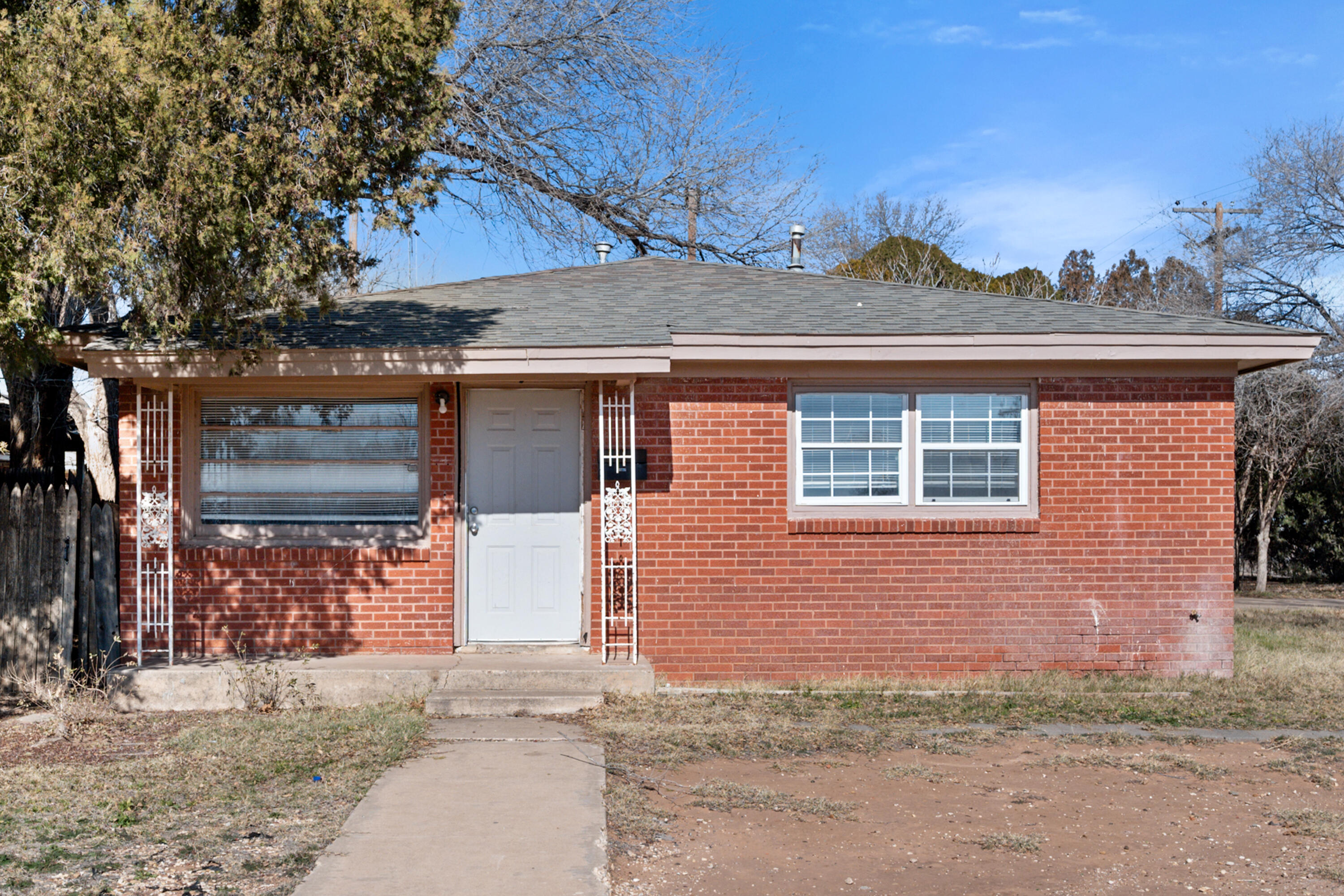 2302 62nd Street Lubbock, TX 79412 - Photo 3 of 38 front view of a house with a yard