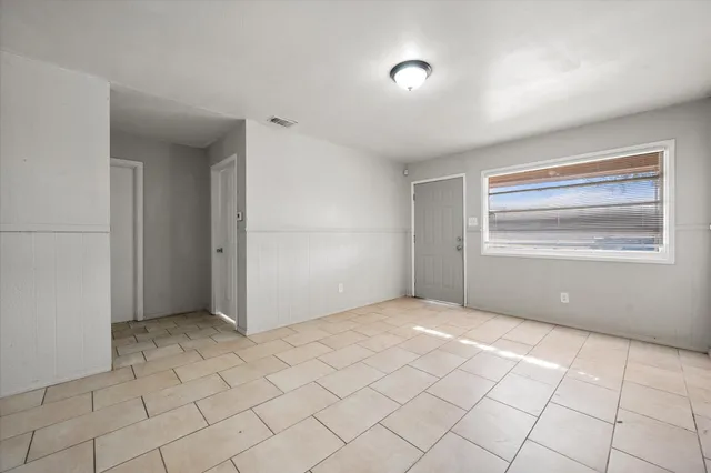 a view of an empty room and window