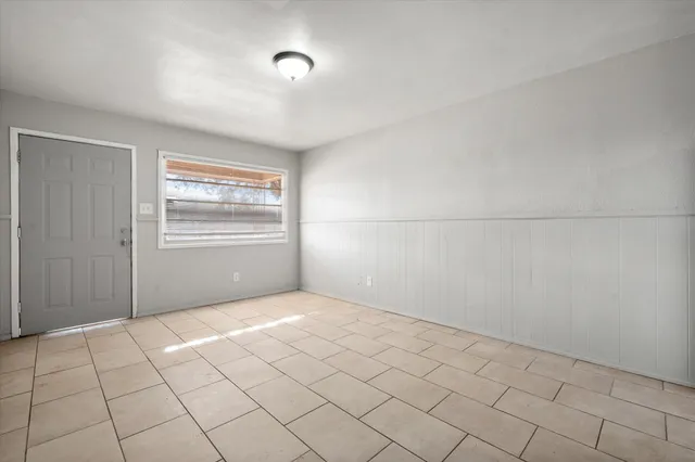 a kitchen with a refrigerator a sink and cabinets