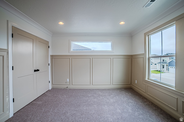 223 South Cottonwood Road, Unit 7501 Vineyard, UT 84059 - Photo 22 of 45 Carpeted interior room featuring crown molding, recessed lighting, and wainscoting