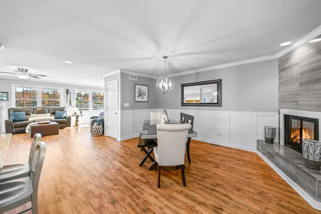 a view of a lake with couches and wooden floor