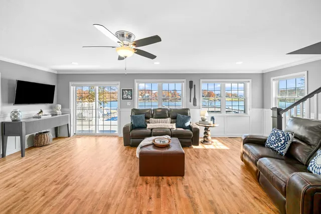 a view of a balcony with wooden chairs