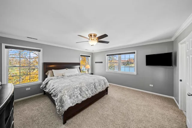 a view of a house with pool and ocean view