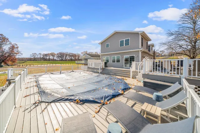 a view of swimming pool with an outdoor space and seating area