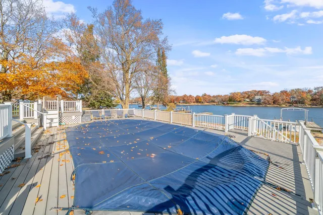 an aerial view of a house with a lake view