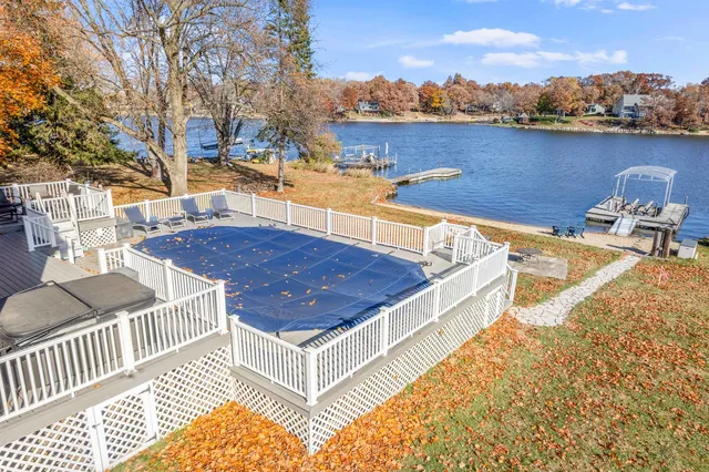 an aerial view of a house with a lake view