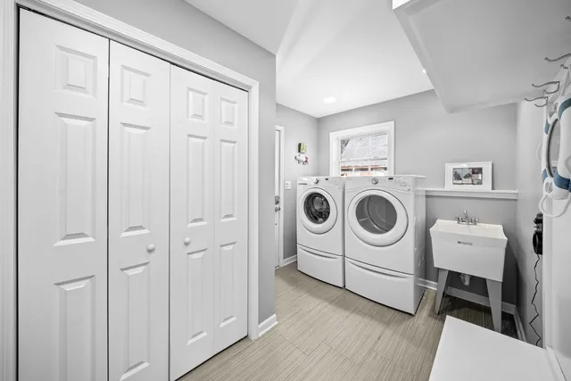 a kitchen with stainless steel appliances kitchen island granite countertop a stove a sink a oven a dining table and chairs