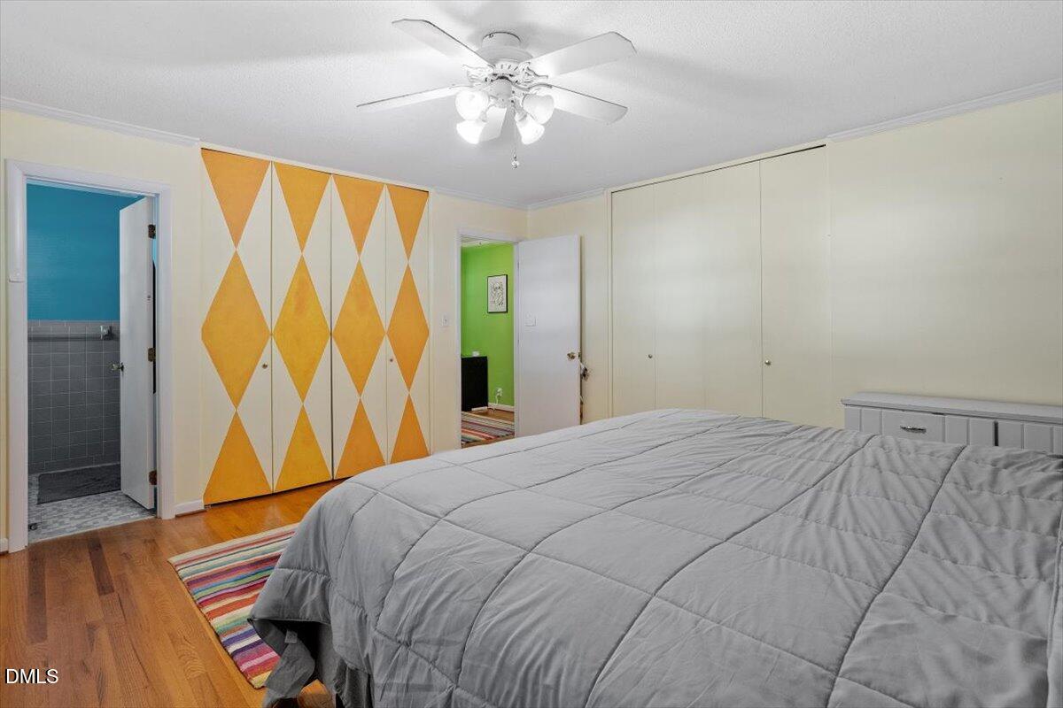 2100 Nancy Ann Drive Raleigh, NC 27607 - Photo 27 of 33 a bedroom with a bed and a painting on the wall