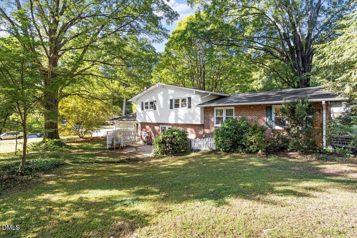 2100 Nancy Ann Drive Raleigh, NC 27607 - Photo 7 of 33 a front view of a house with a yard