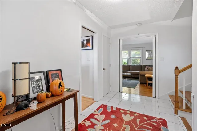 a bedroom with furniture and a mirror