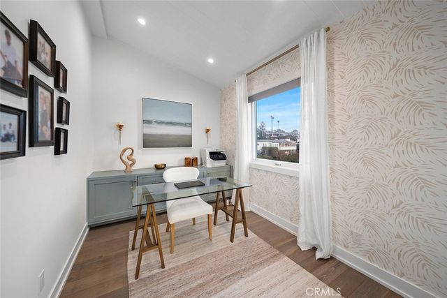 a bathroom with a sink mirror and a shower