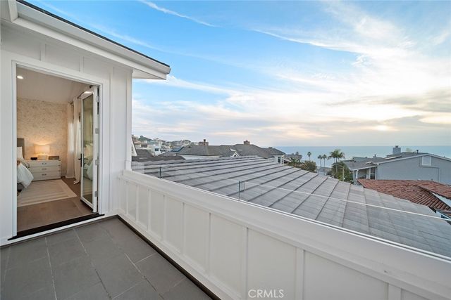 a living room with furniture a wooden floor and next to a window