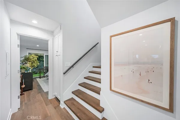 a view of kitchen with furniture and refrigerator