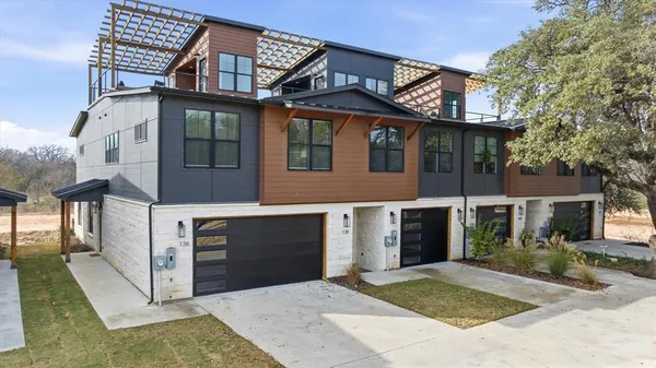 a front view of a house with yard