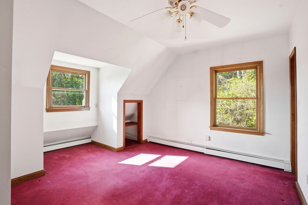 67 Wituwamat Road Weymouth, MA 02191 - Photo 23 of 42 an empty room with windows and fan