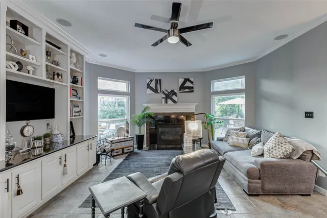 a living room with furniture fireplace and window