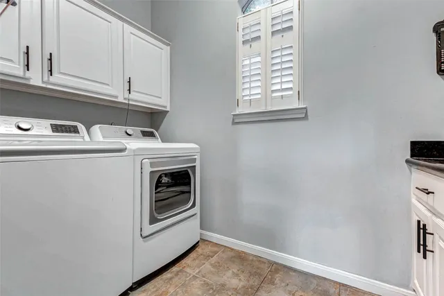 a living room with furniture ceiling fan and a flat screen tv