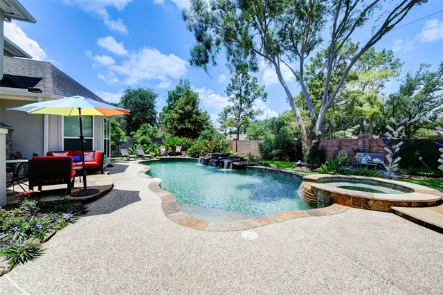 a view of a swimming pool with a patio
