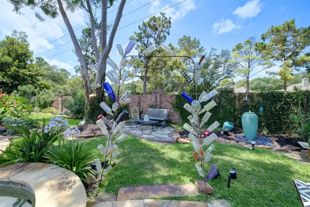 a swimming pool with outdoor seating yard and barbeque oven