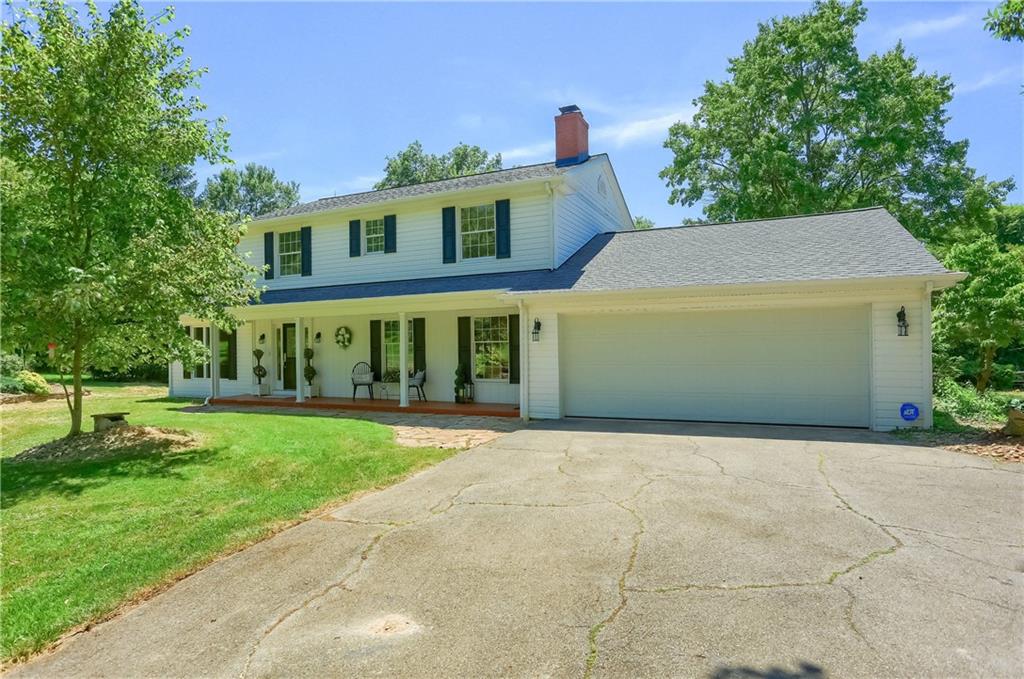 610 Dick Road Renfrew, PA 16001 - Photo 1 of 25 a front view of a house with a yard and trees